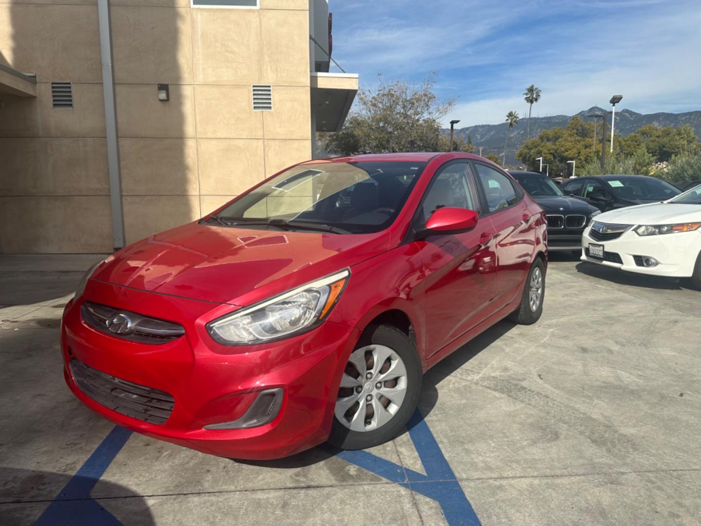 2015 Red /Gray Hyundai Accent GLS Sedan 4D (KMHCT4AE2FU) with an 4-Cyl, 1.6L engine, Auto, 6-Spd w/Overdrive transmission, located at 30 S. Berkeley Avenue, Pasadena, CA, 91107, (626) 248-7567, 34.145447, -118.109398 - The 2015 Hyundai Accent 4-Door Sedan stands as a testament to Hyundai's commitment to quality, efficiency, and value. Located in Pasadena, CA, our dealership specializes in providing a wide range of used BHPH (Buy Here Pay Here) cars, trucks, SUVs, and vans, including the remarkable Hyundai Accent. - Photo#1